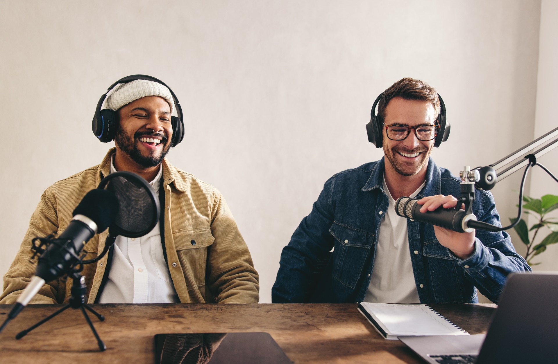 Male radio presenters having a great time in a studio