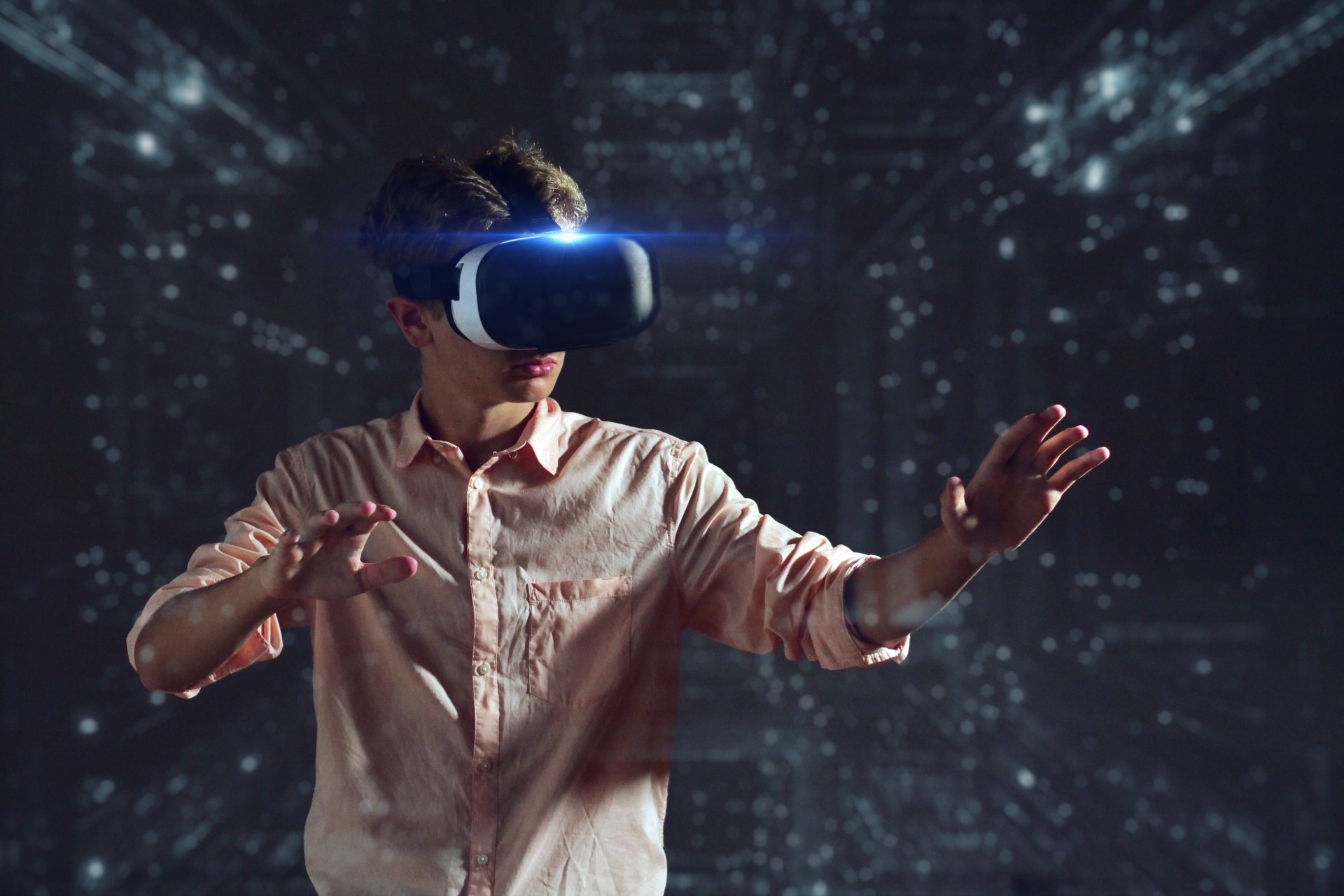 Portrait of a boy using an oculus and having a futuristic trip with holograms.