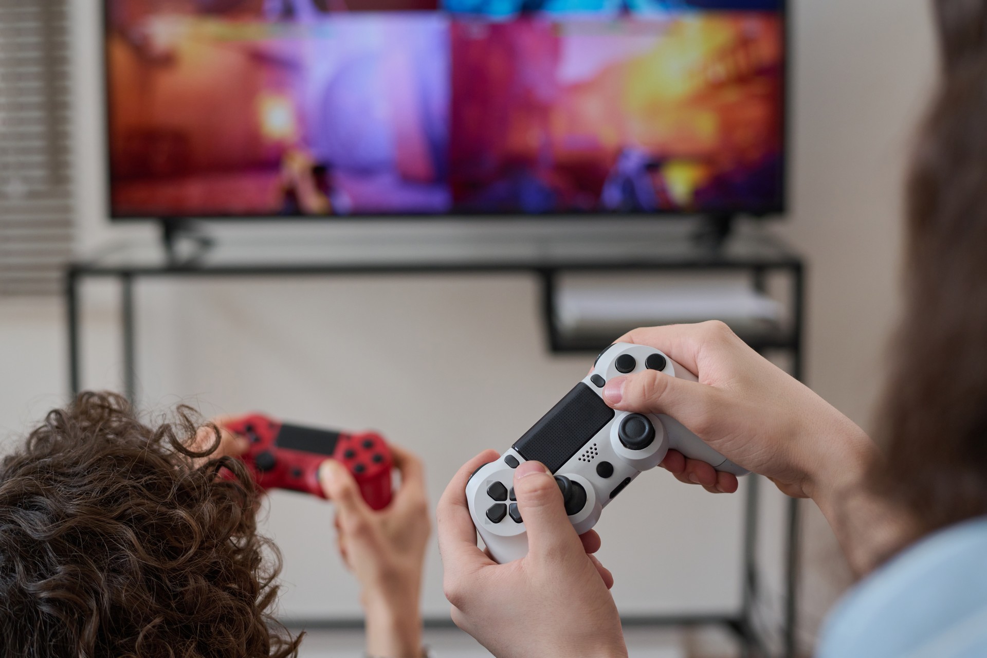 Family playing with joysticks together